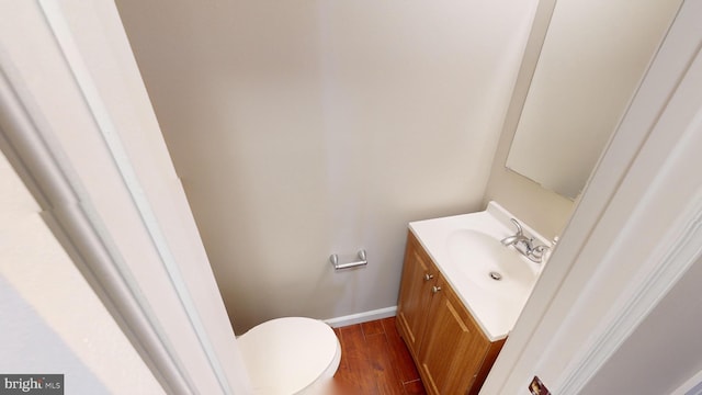 12459 Charter Oak Ct, Waldorf, MD 20601 - bathroom with vanity, hardwood / wood-style floors, and toilet