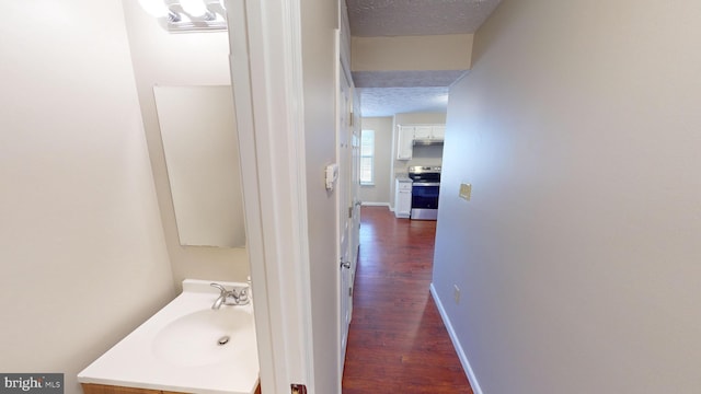 12459 Charter Oak Ct, Waldorf, MD 20601 - bathroom featuring vanity, hardwood / wood-style flooring, and a textured ceiling