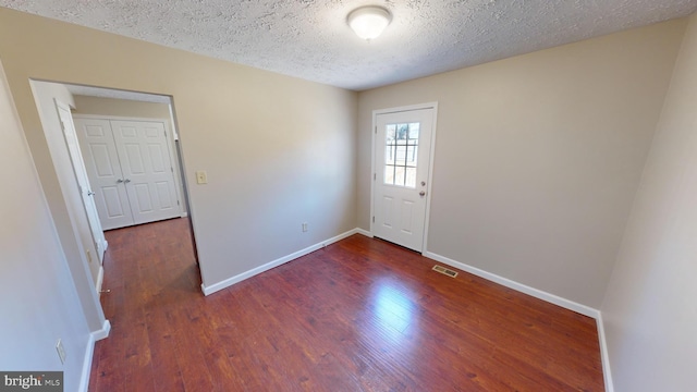 12459 Charter Oak Ct, Waldorf, MD 20601 - interior space with dark hardwood / wood-style floors and a textured ceiling
