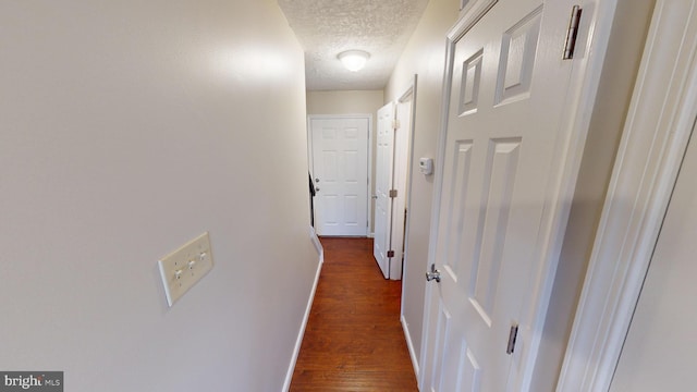 12459 Charter Oak Ct, Waldorf, MD 20601 - hall with dark wood-type flooring and a textured ceiling