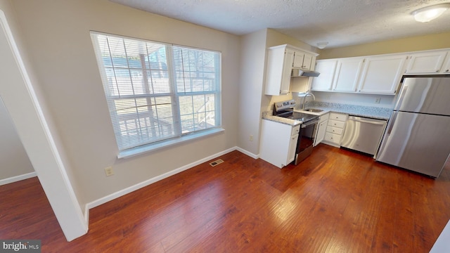 12459 Charter Oak Ct, Waldorf, MD 20601 - kitchen featuring white cabinetry, sink, dark wood-type flooring, and stainless steel appliances