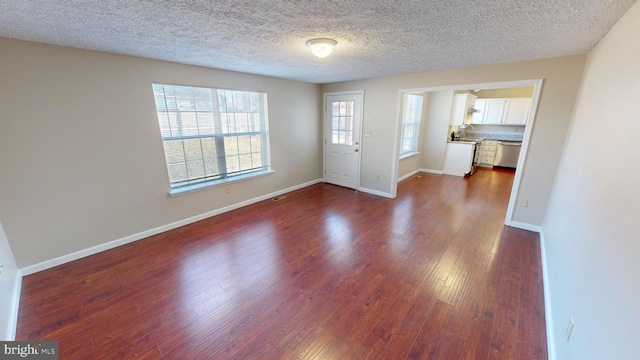 12459 Charter Oak Ct, Waldorf, MD 20601 - foyer entrance featuring dark hardwood / wood-style floors and a textured ceiling