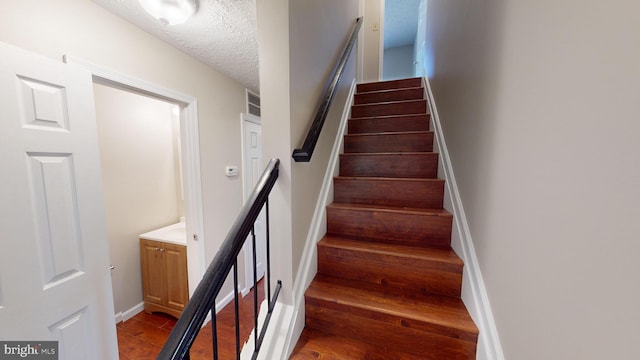 12459 Charter Oak Ct, Waldorf, MD 20601 - staircase with a textured ceiling