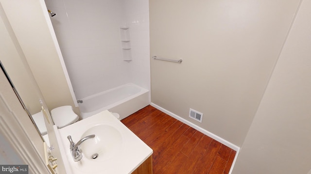 12459 Charter Oak Ct, Waldorf, MD 20601 - full bathroom featuring hardwood / wood-style floors, tub / shower combination, sink, and toilet