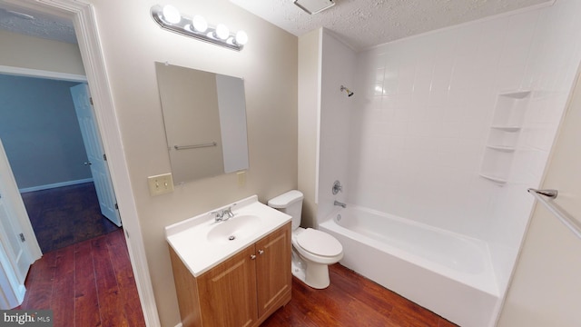 12459 Charter Oak Ct, Waldorf, MD 20601 - full bathroom with  shower combination, toilet, hardwood / wood-style floors, and a textured ceiling