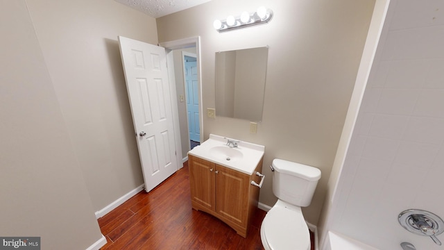 12459 Charter Oak Ct, Waldorf, MD 20601 - bathroom featuring vanity, wood-type flooring, a textured ceiling, and toilet