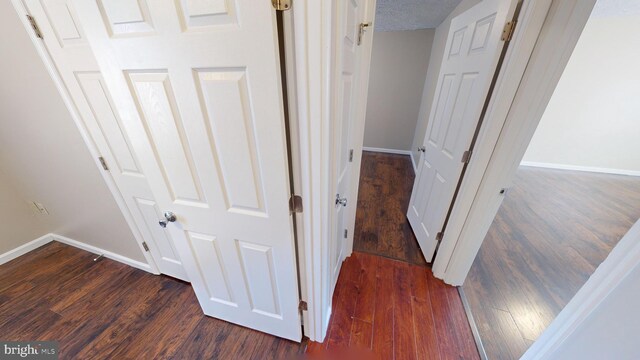 12459 Charter Oak Ct, Waldorf, MD 20601 - hallway featuring a textured ceiling and dark hardwood / wood-style flooring