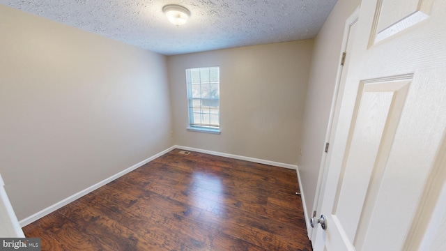 12459 Charter Oak Ct, Waldorf, MD 20601 - spare room featuring dark hardwood / wood-style flooring and a textured ceiling
