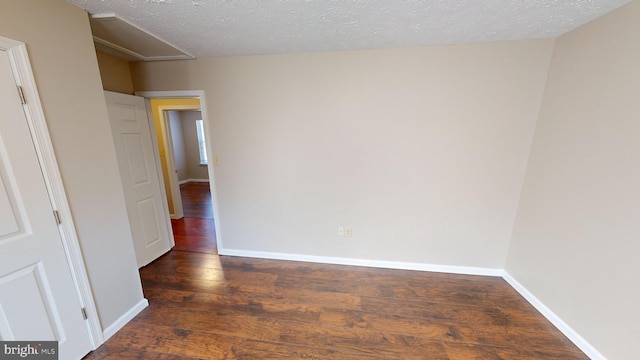12459 Charter Oak Ct, Waldorf, MD 20601 - spare room featuring a textured ceiling and dark hardwood / wood-style flooring