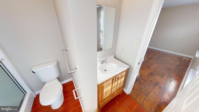 12459 Charter Oak Ct, Waldorf, MD 20601 - bathroom featuring vanity, toilet, a shower with shower door, and wood-type flooring