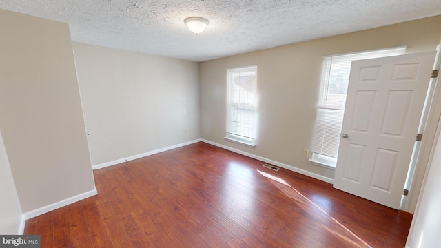 12459 Charter Oak Ct, Waldorf, MD 20601 - foyer featuring dark hardwood / wood-style floors and a textured ceiling