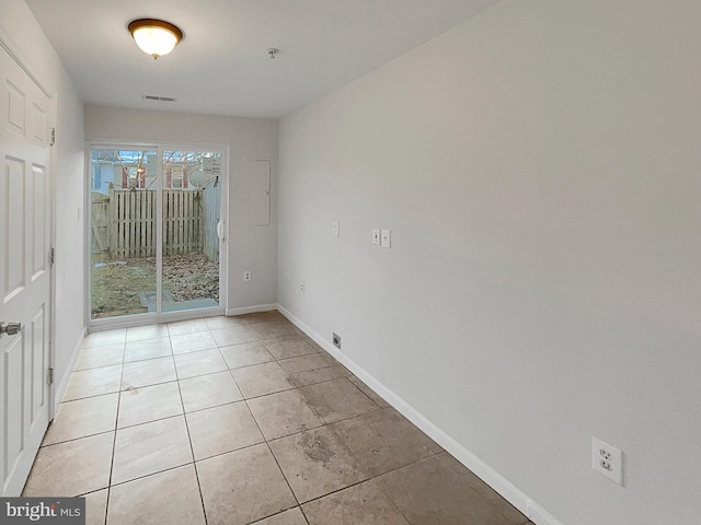 unfurnished room with light tile patterned floors