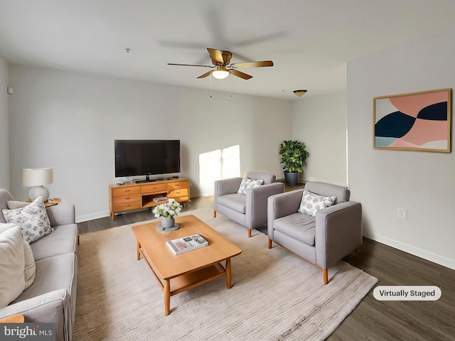 living room featuring ceiling fan and hardwood / wood-style floors