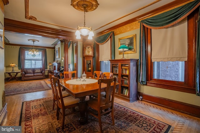 dining room featuring crown molding and an inviting chandelier