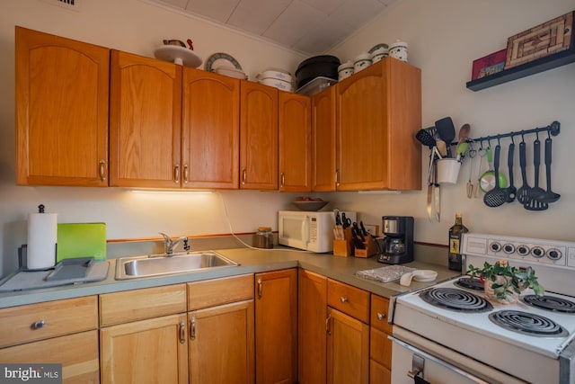 kitchen featuring sink and white appliances