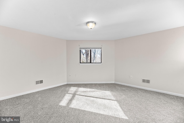 unfurnished room with carpet flooring