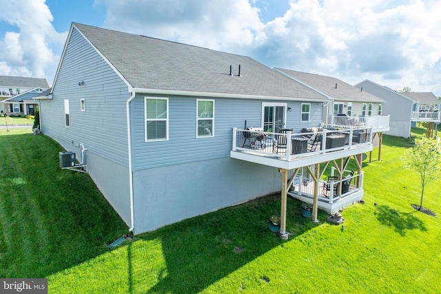 108 Zachary Way, Pottstown, PA 19464 - back of property with a wooden deck, a lawn, a shingled roof, central air condition unit, and a residential view
