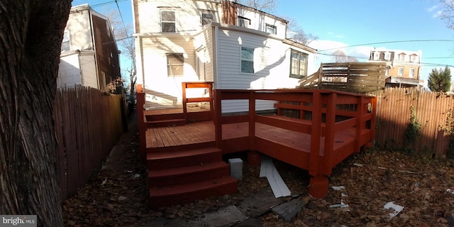 rear view of house featuring a deck