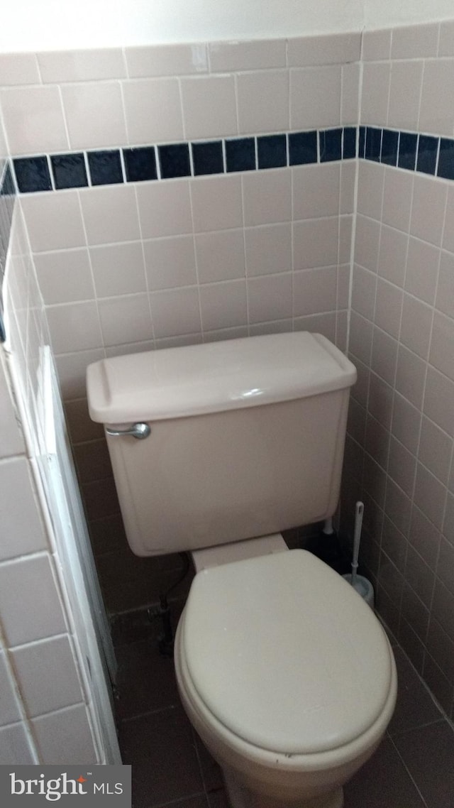 bathroom with tile patterned floors and toilet