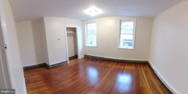 additional living space with dark hardwood / wood-style floors