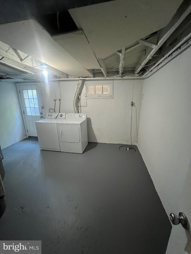 basement with washing machine and clothes dryer