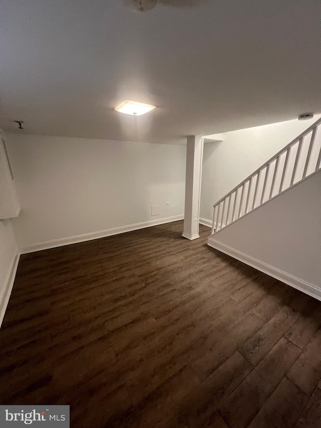 basement featuring dark hardwood / wood-style floors