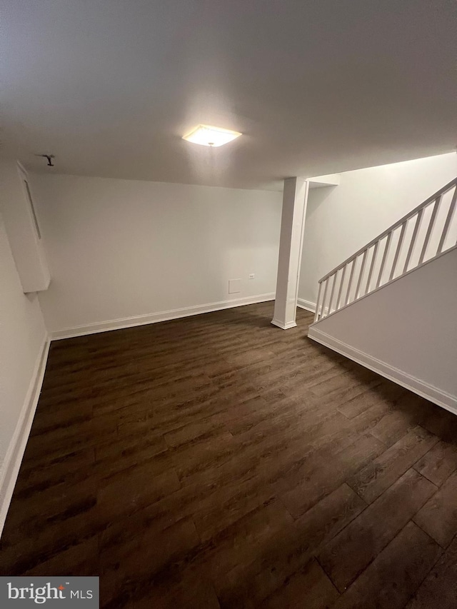 basement with dark wood-type flooring