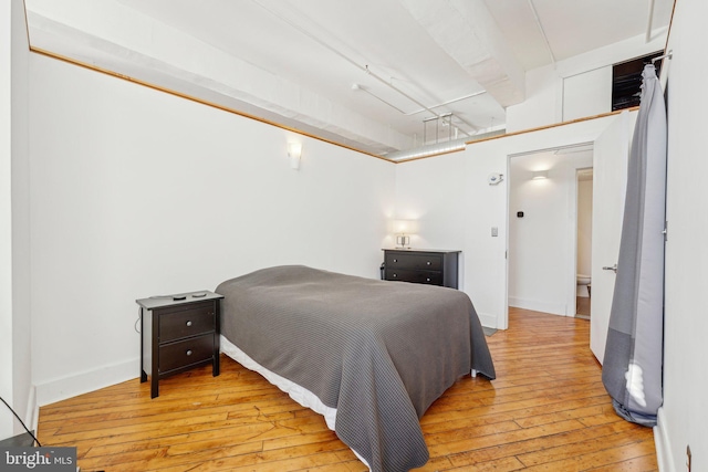 bedroom with light wood-type flooring