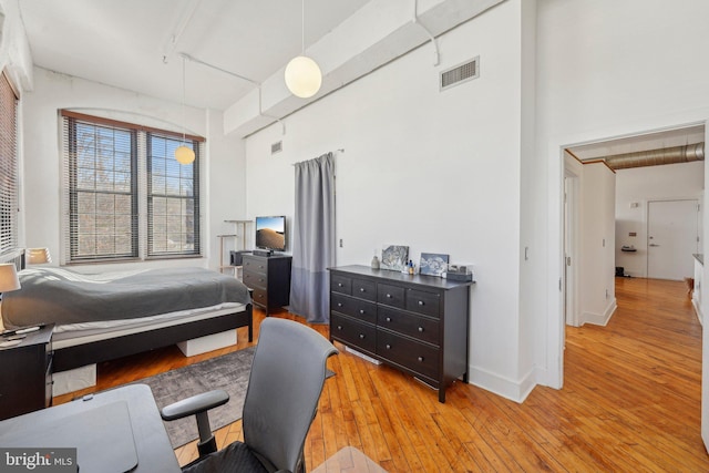 bedroom with light wood-type flooring