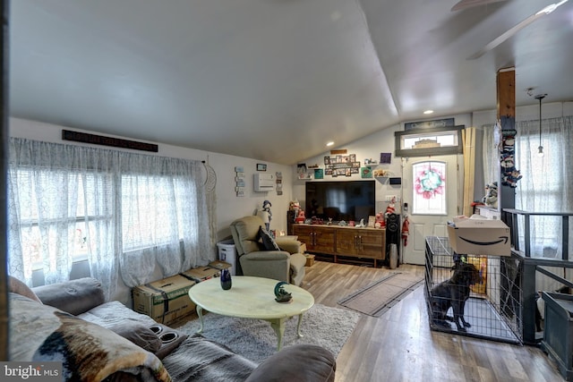 living room with lofted ceiling and hardwood / wood-style floors