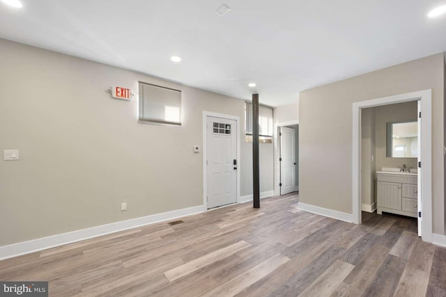 interior space with sink and light hardwood / wood-style floors