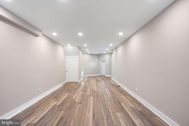 spare room with light hardwood / wood-style flooring