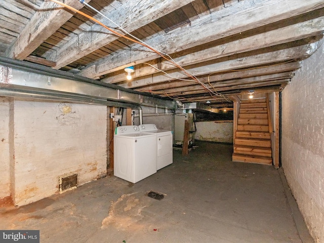 basement with washing machine and dryer