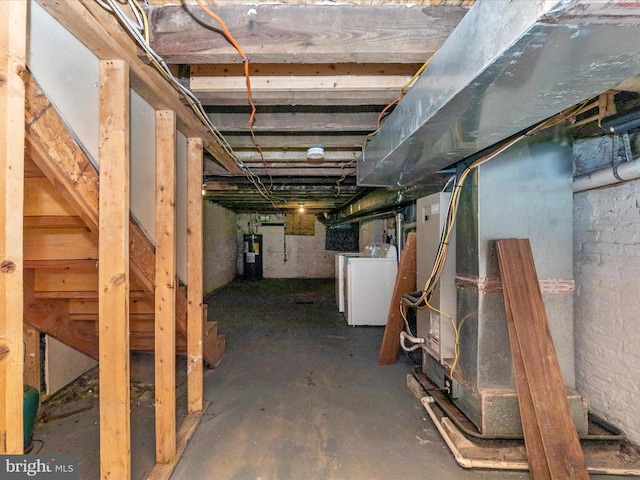 basement featuring washer / dryer and electric water heater