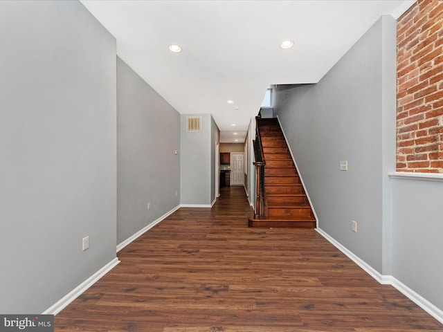 staircase featuring hardwood / wood-style flooring