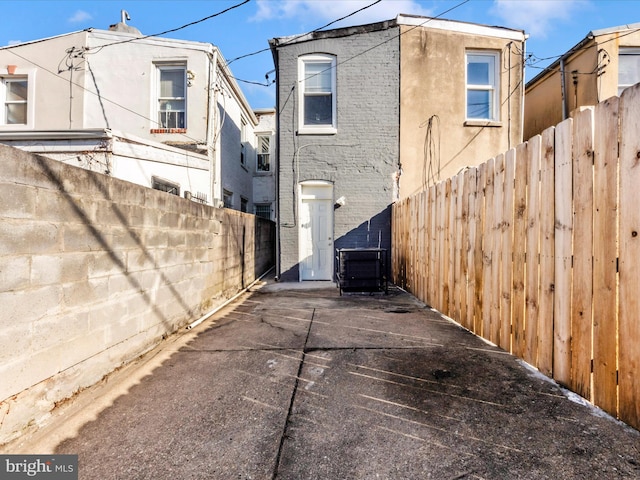 view of side of home featuring central AC