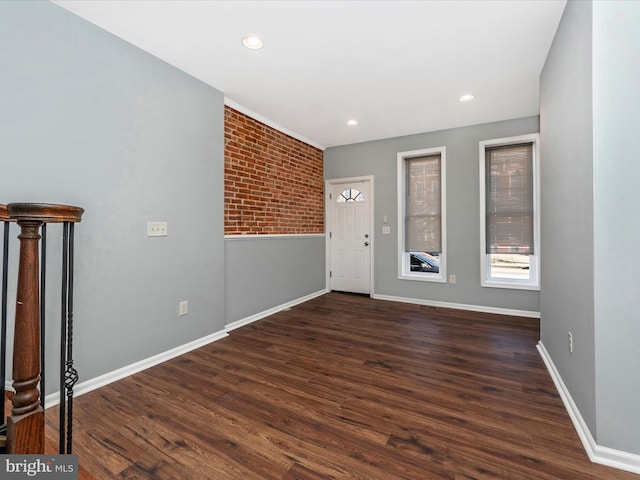 foyer entrance featuring dark wood-type flooring