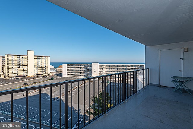 balcony featuring a water view