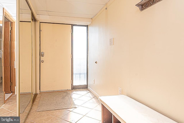 entryway featuring light tile patterned floors