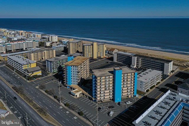 birds eye view of property featuring a water view and a view of the beach