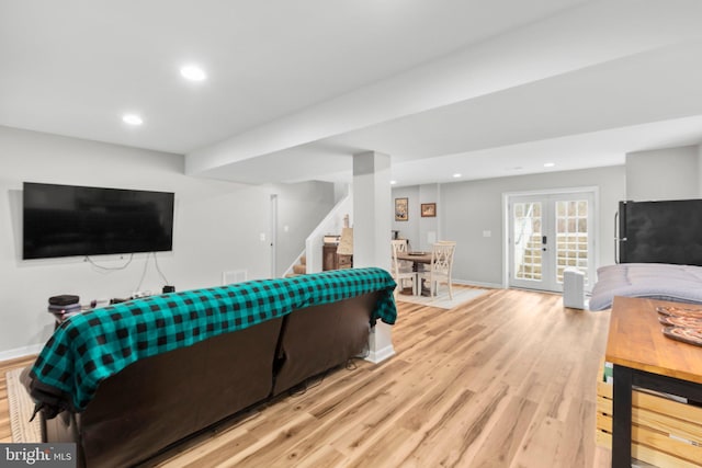 living room featuring light hardwood / wood-style flooring and french doors