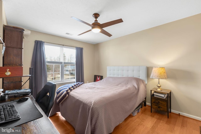 bedroom with light wood-type flooring and ceiling fan