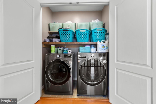 laundry room with independent washer and dryer