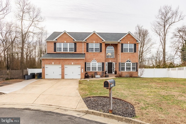 view of front facade featuring a front yard and a garage