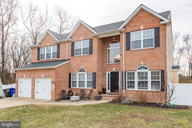 view of front facade featuring a front yard and a garage