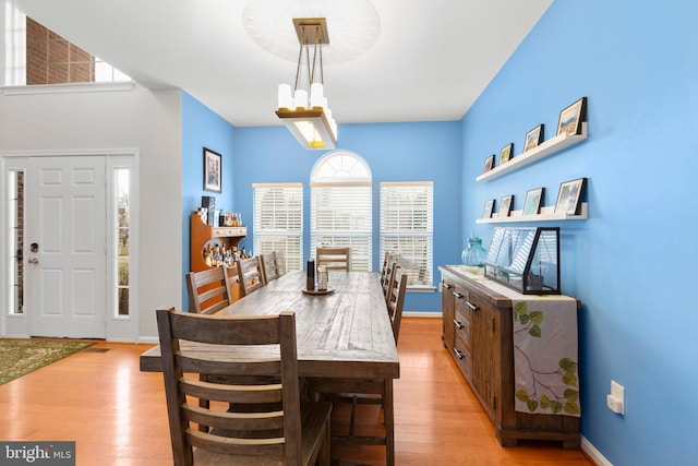 dining space featuring light wood-type flooring