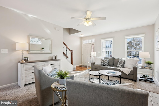 carpeted living room featuring ceiling fan