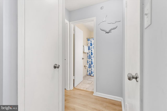 hallway featuring light wood-type flooring