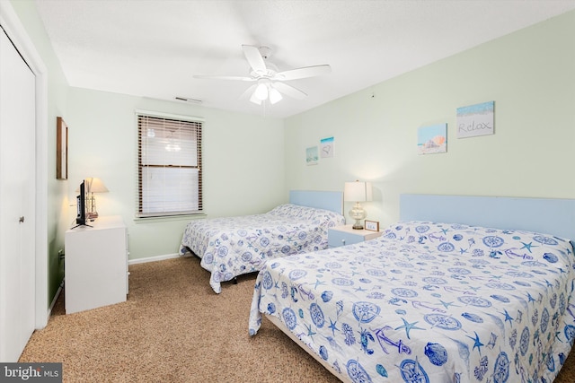 bedroom with carpet floors, a closet, and ceiling fan