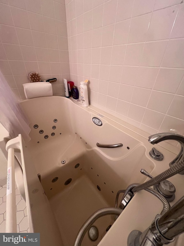 bathroom featuring a tub to relax in